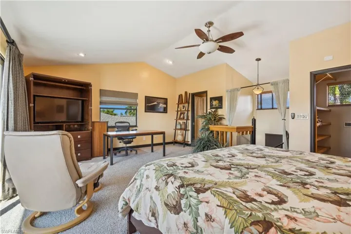 Second Floor Master Suite -Vaulted  ceiling and ceiling fan -Opens to balcony