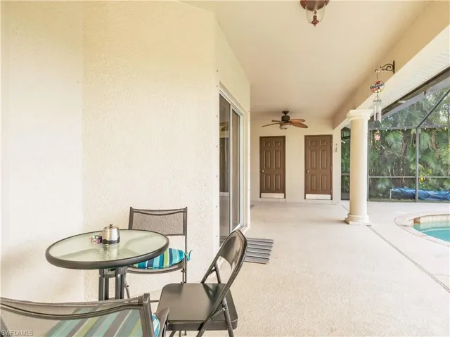 View of patio / terrace with glass enclosure and ceiling fan