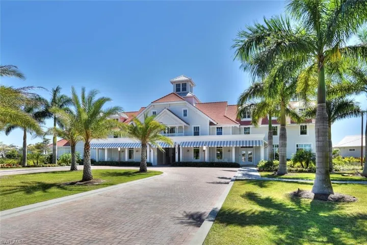 View of building exterior with decorative driveway