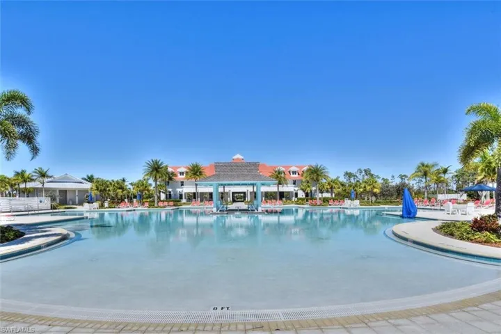 Community pool with a patio
