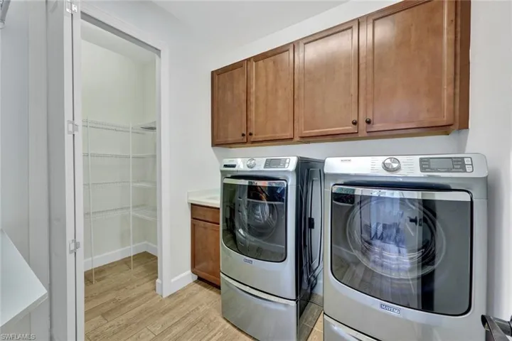 Laundry Room with wash sink & storage closet.