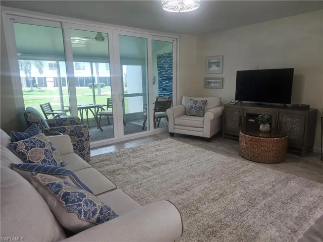 Living area featuring tile patterned flooring