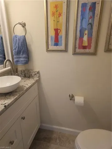 Bathroom with vanity and tile patterned floors
