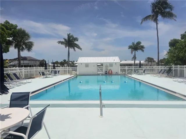 Community pool featuring a patio