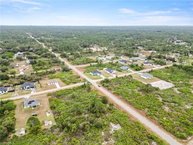 Aerial view with a view of trees and a residential view