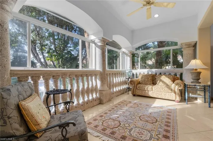 Sunroom / solarium with vaulted ceiling and ceiling fan