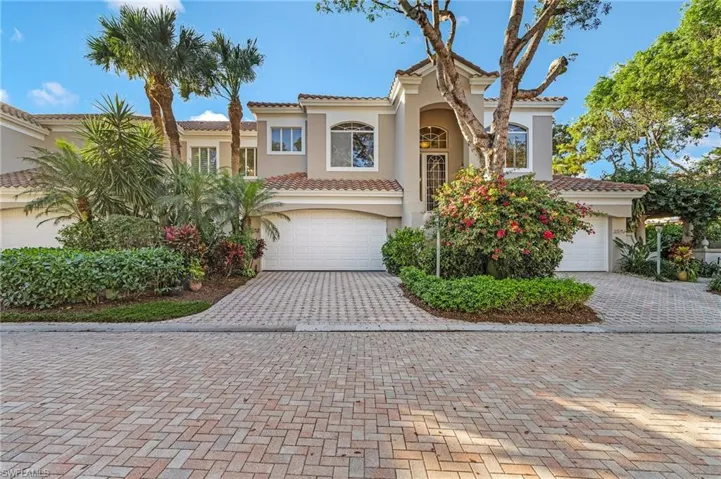 Mediterranean / spanish-style house featuring a garage