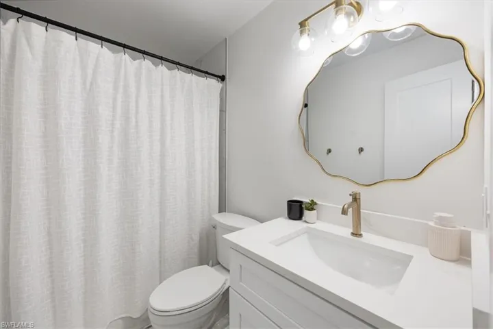 Bathroom with vanity and toilet