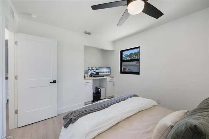 Bedroom with light wood-type flooring and ceiling fan
