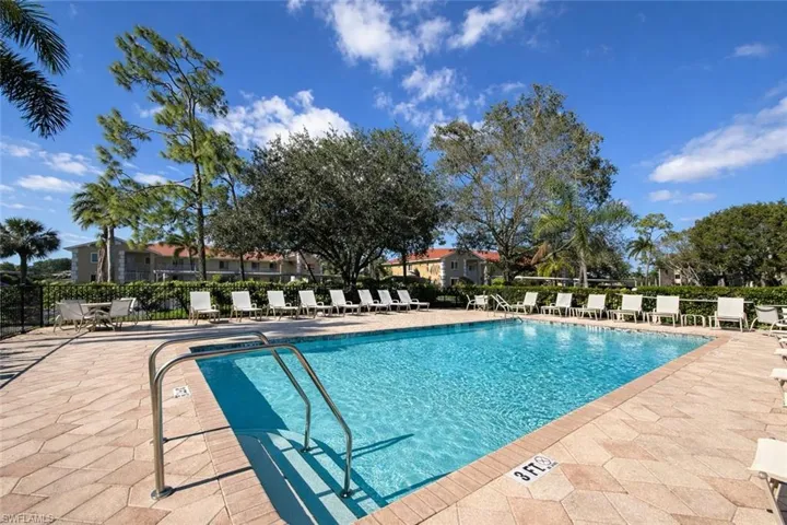 Community pool with a patio area