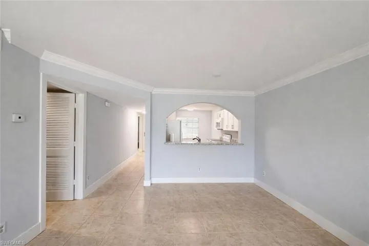 Empty room featuring ornamental molding