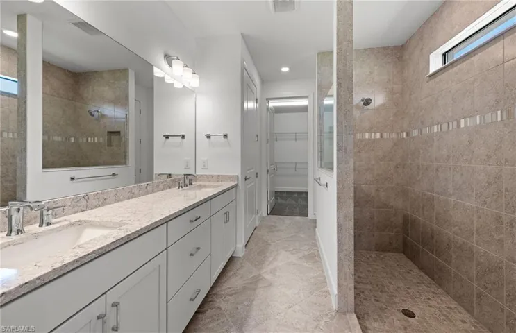 Oversized walk-in shower, dual sinks