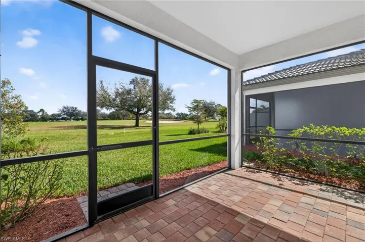 Unfurnished sunroom with view of golf course