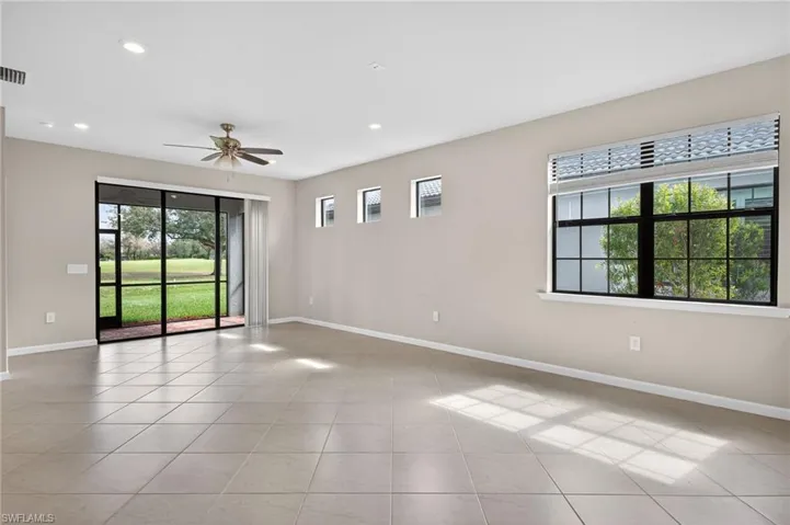 Living Room featuring recessed lighting, ceiling fan, and light tile patterned floors
