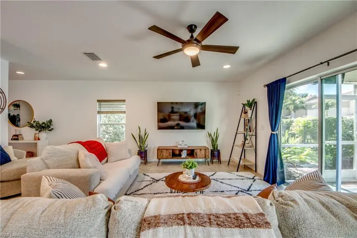 Living room featuring ceiling fan