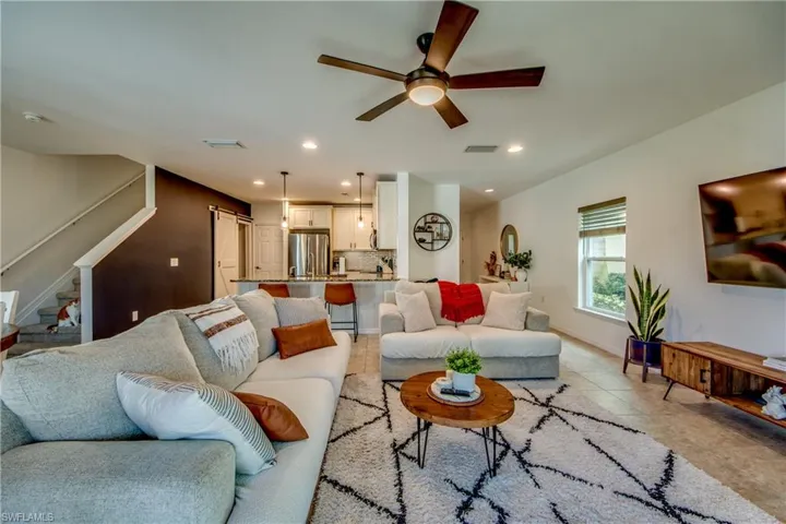 Tiled living room with ceiling fan