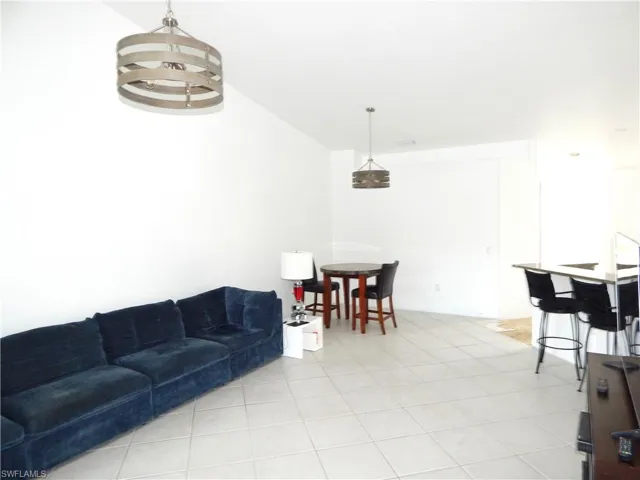 Living room featuring light tile patterned floors
