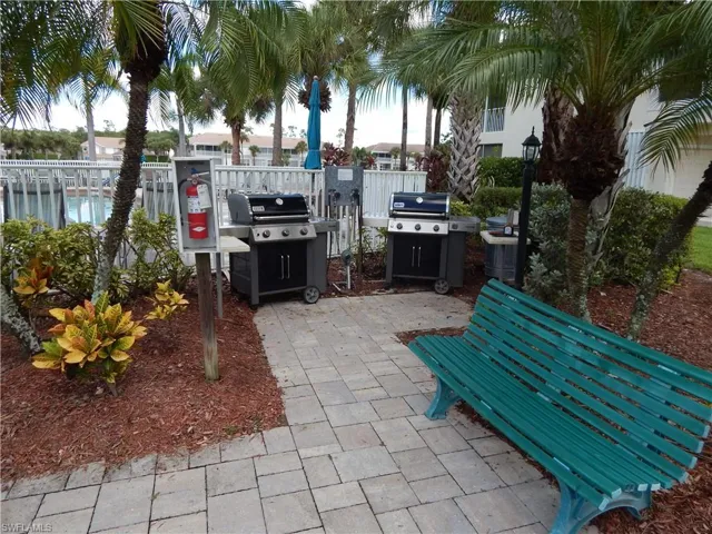 View of community patio featuring area for grilling
