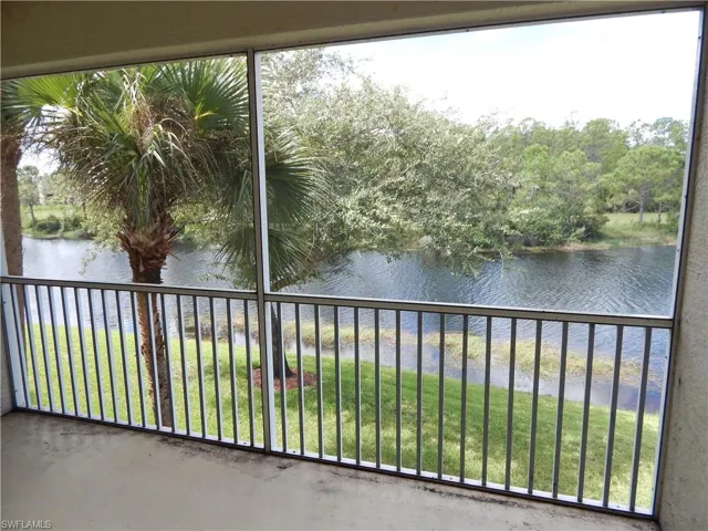 Unfurnished sunroom featuring a water view