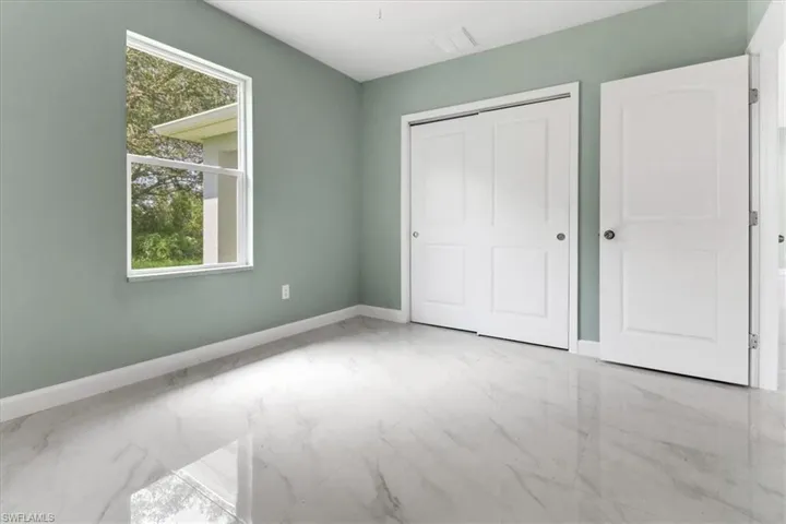 Unfurnished bedroom featuring a closet