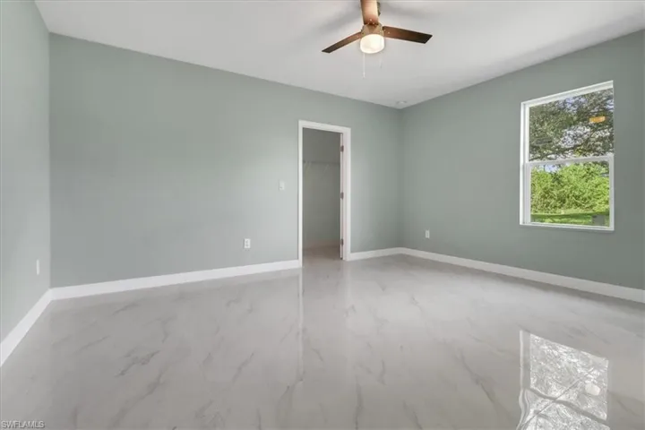 Unfurnished room with ceiling fan
