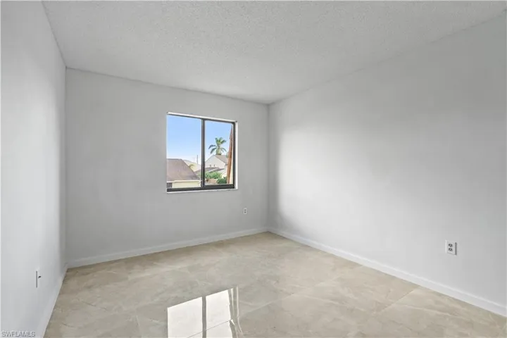 Spare room featuring a textured ceiling