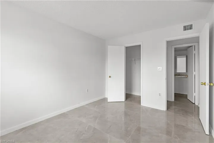 Unfurnished bedroom featuring a closet and a textured ceiling