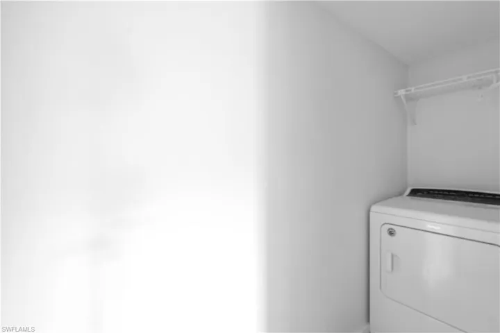Washroom featuring washer / clothes dryer
