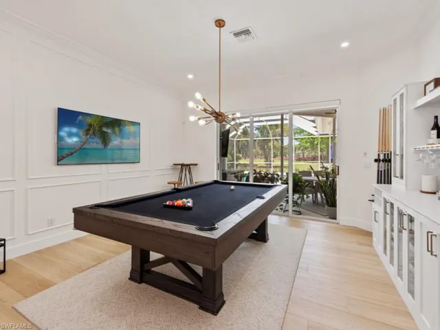 Kitchen featuring wine cooler, smart refrigerator, light wood-style floors, and visible vents