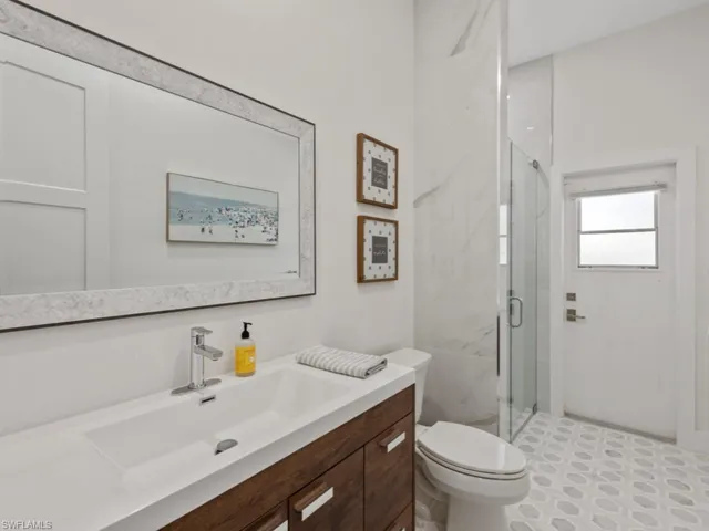 Bedroom with light wood-style flooring, recessed lighting, a closet, and ornamental molding