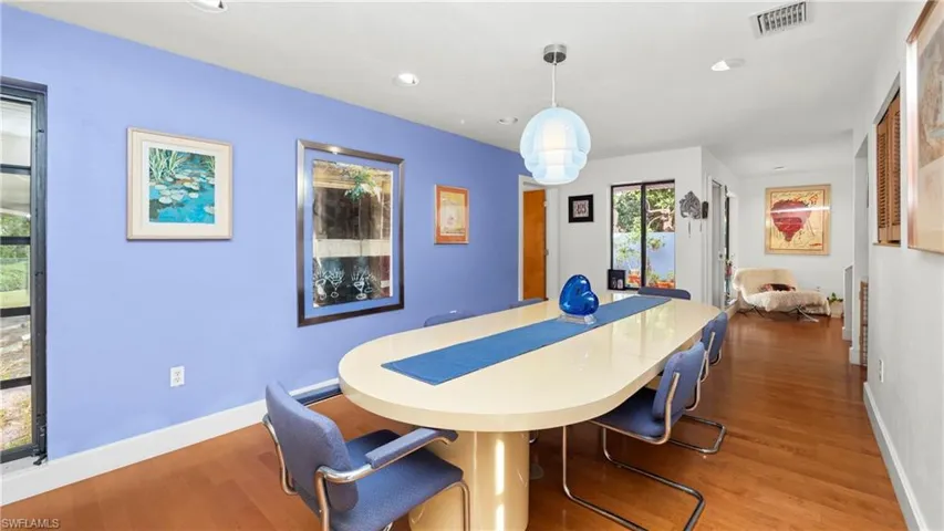Dining space featuring wood finished floors and recessed lighting