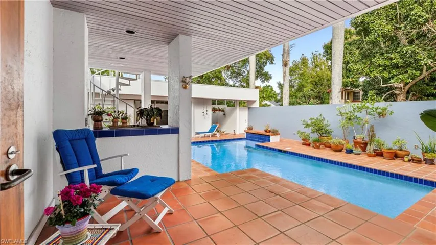 View of pool featuring a patio area and a fenced backyard