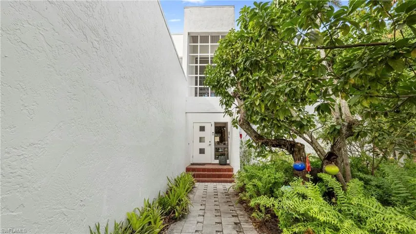 Property entrance with stucco siding