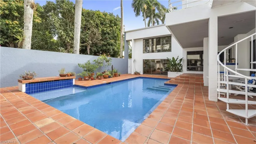 View of swimming pool with a patio