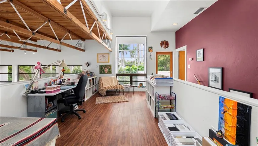 Office space featuring dark wood-style flooring