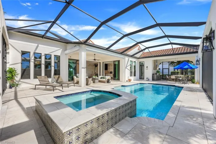 Rear view of property featuring a patio area, stucco siding, ceiling fan, an outdoor hangout area, and outdoor dining space
