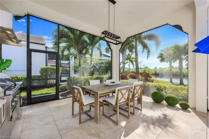Sunroom / solarium with a water view