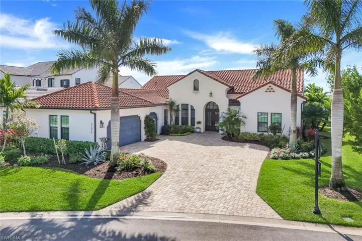 Mediterranean / spanish-style house featuring stucco siding, an attached garage, decorative driveway, and a tiled roof