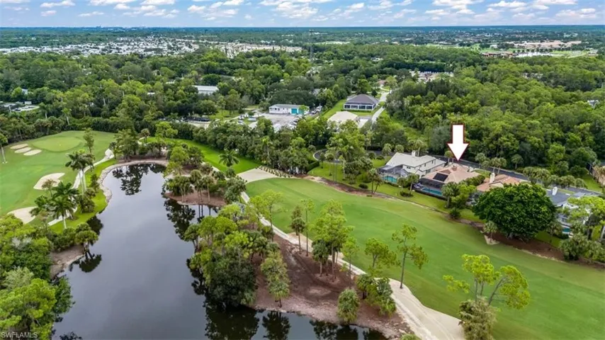 Aerial view of a local golf course and a large body of water