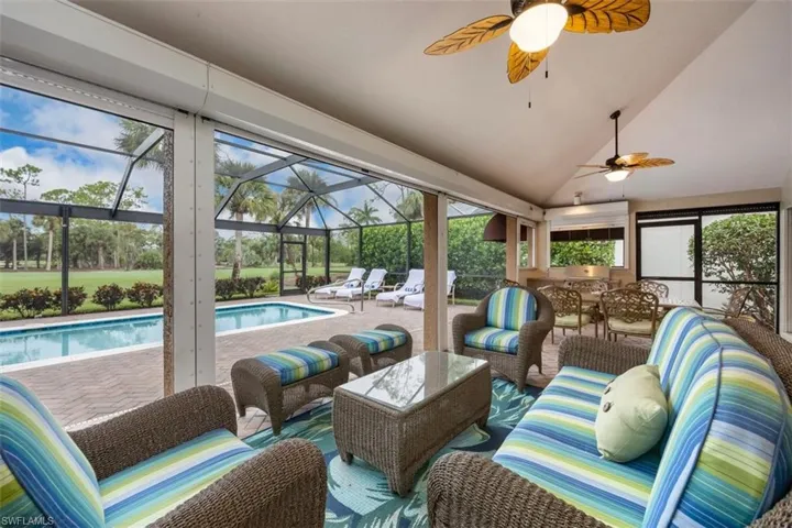 Sunroom with lofted ceiling, a patio, outdoor lounge area, and a ceiling fan