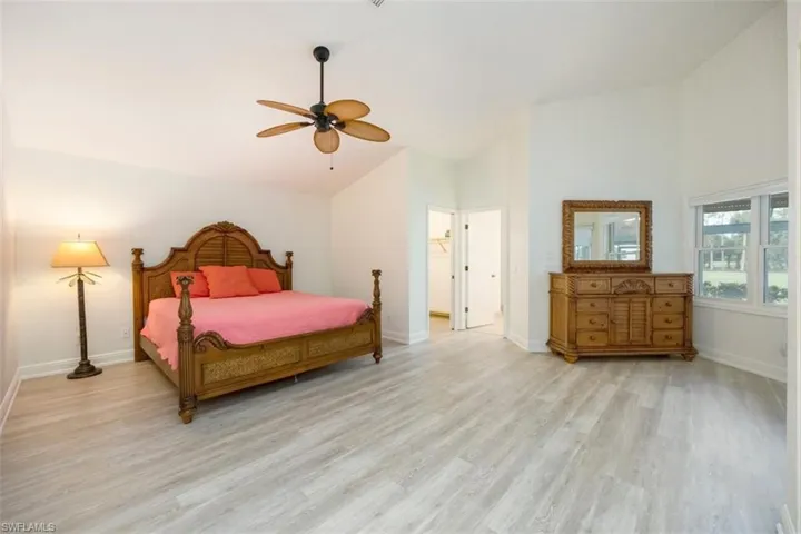 Master Bedroom featuring light wood-type flooring, high vaulted ceiling, and ceiling fan