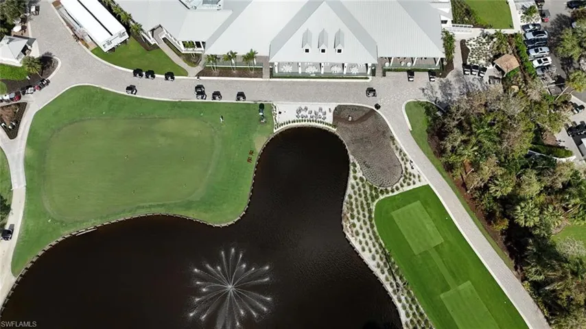 View of property location with a nearby body of water and a local golf course