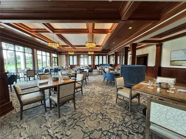 Dining area with ornamental molding, beam ceiling, and coffered ceiling