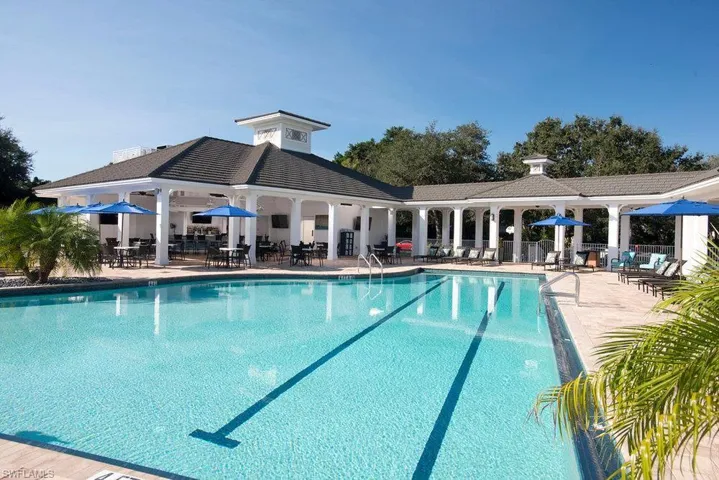 Community pool with a patio