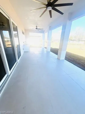 View of patio with ceiling fan and a sink