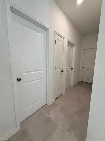 Hall featuring baseboards