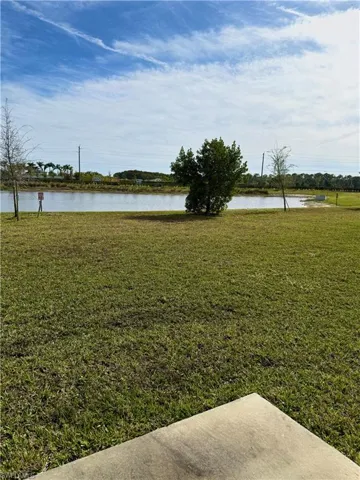 View of grassy yard featuring a water view