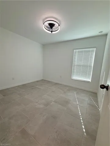 Empty room with baseboards