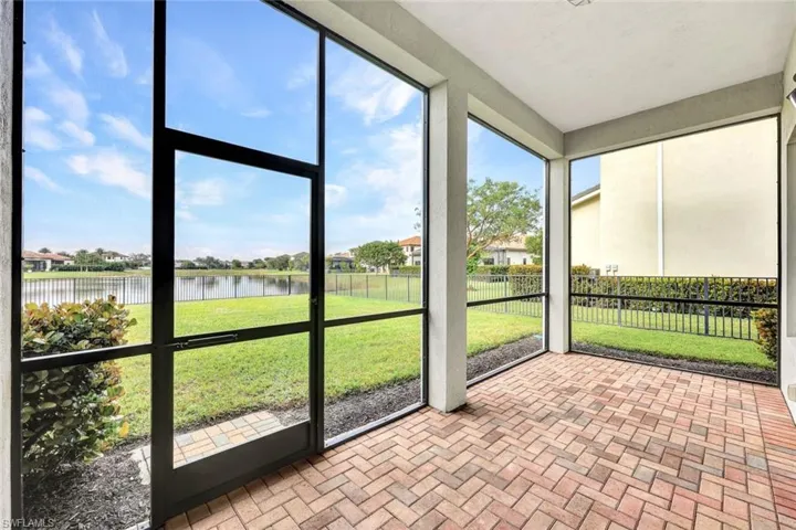 Back of property featuring a yard