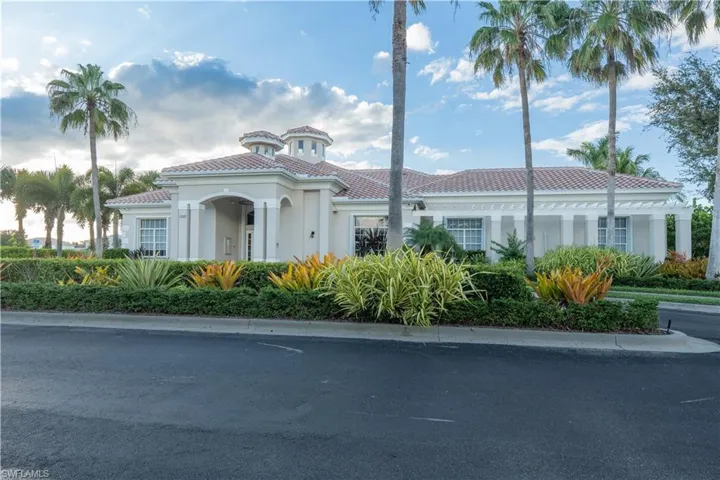 View of front of home with stucco siding and a tile roof